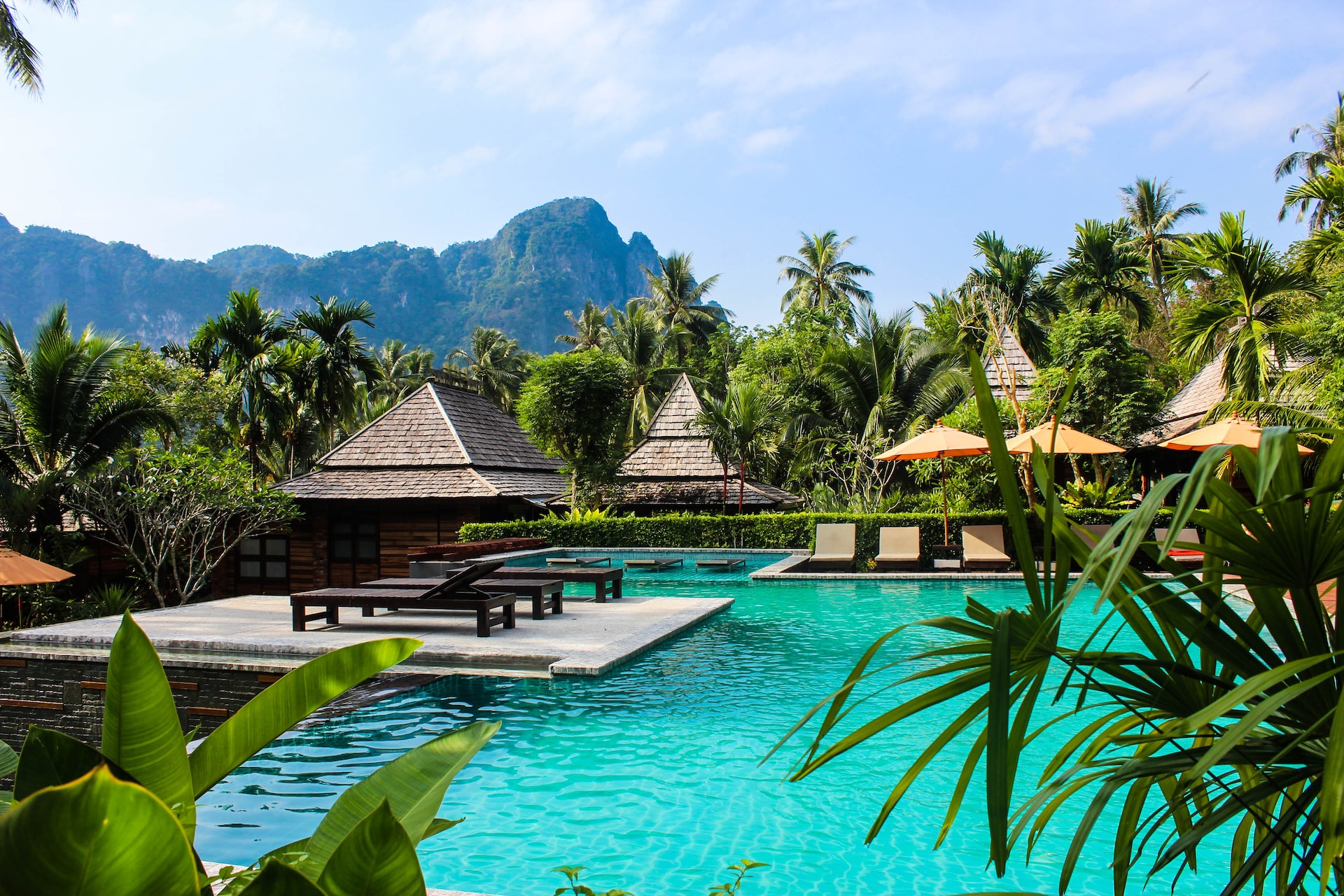 Photo by  Sara Dubler on https://unsplash.com/photos/photo-of-brown-bench-near-swimming-pool-Koei_7yYtIo